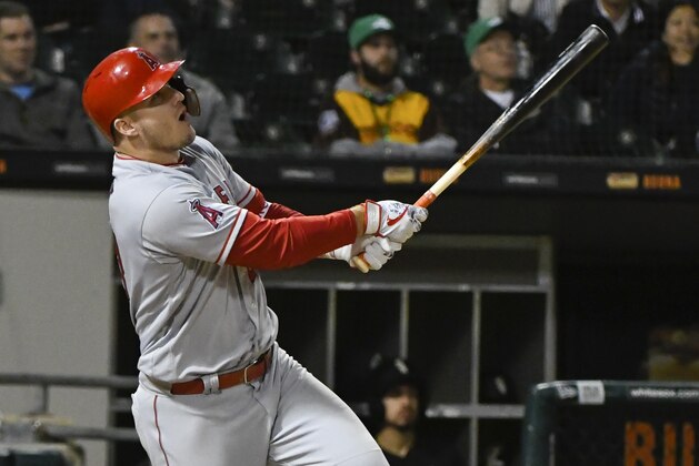 Los Angeles Angels' Mike Trout (27) singles during the ninth inning of a baseball game against the Chicago White Sox on Saturday, Sept. 8, 2018, in Chicago. (AP Photo/Matt Marton)