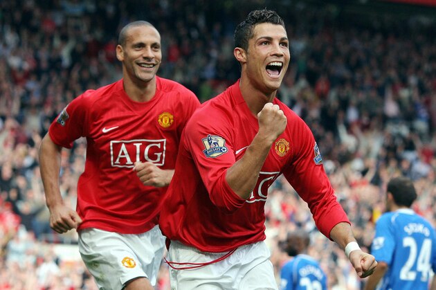 Manchester United's Portuguese forward Cristiano Ronaldo (R) celebrates in front of team-mate Rio Ferdinand after scoring the second goal against WIgan Athletic during the Premier league football match at Old Trafford, Manchester, north-west England, 06 October 2007.  AFP PHOTO / ANDREW YATES   Mobile and website use of domestic English football pictures are subject to obtaining a Photographic End User Licence from Football DataCo Ltd Tel : +44 (0) 207 864 9121 or e-mail accreditations@football-dataco.com - applies to Premier and Football League matches. (Photo credit should read ANDREW YATES/AFP/Getty Images)
