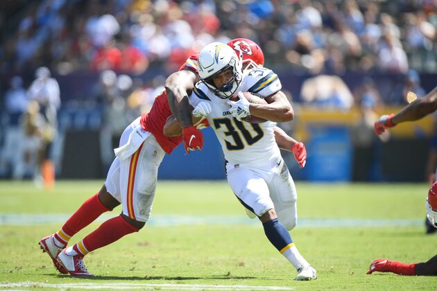 CARSON, CA - SEPTEMBER 09: Running back Austin Ekeler #30 of the Los Angeles Chargers is hit by linebacker Anthony Hitchens #53 of the Kansas City Chiefs in the first quarter at StubHub Center on September 9, 2018 in Carson, California. (Photo by Harry How/Getty Images)