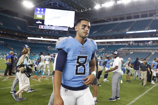 Tennessee Titans quarterback Marcus Mariota (8) walks off the field at the end of an NFL football game against the Miami Dolphins, Sunday, Sept. 9, 2018, in Miami Gardens, Fla. The Dolphins defeated the Titans 27-20. (AP Photo/Brynn Anderson)