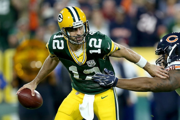 GREEN BAY, WI - SEPTEMBER 09: Aaron Rodgers #12 of the Green Bay Packers avoids being sacked by Akiem Hicks #96 of the Chicago Bears during the first quarter of a game at Lambeau Field on September 9, 2018 in Green Bay, Wisconsin.  (Photo by Dylan Buell/Getty Images)