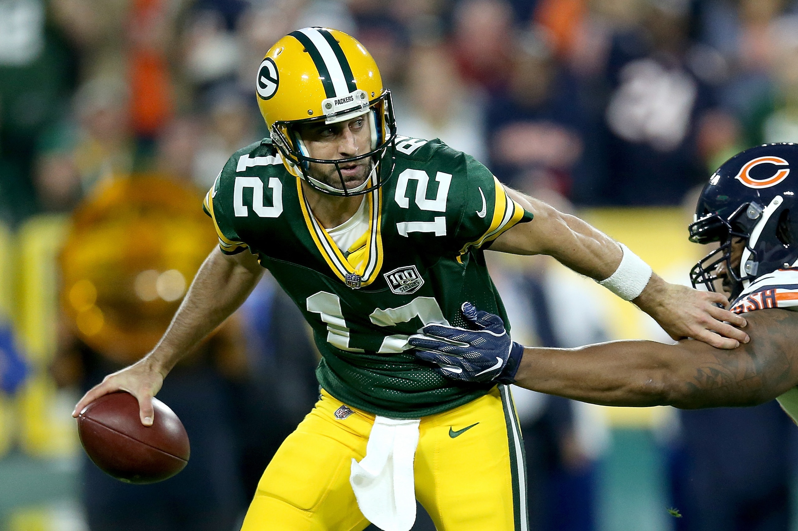 GREEN BAY, WI - SEPTEMBER 09: Aaron Rodgers #12 of the Green Bay Packers avoids being sacked by Akiem Hicks #96 of the Chicago Bears during the first quarter of a game at Lambeau Field on September 9, 2018 in Green Bay, Wisconsin.  (Photo by Dylan Buell/Getty Images)