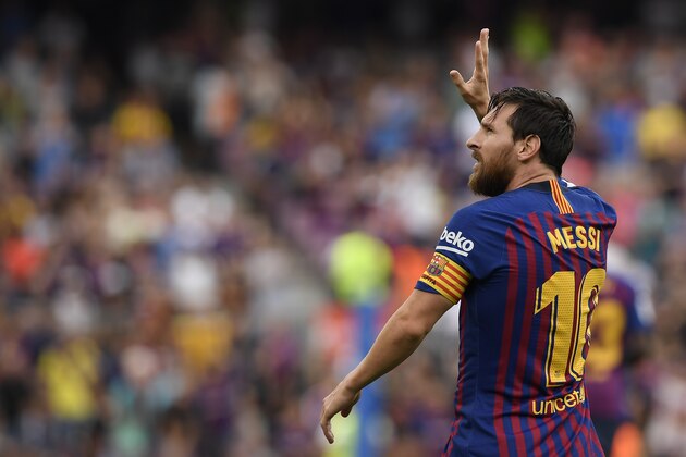 Barcelona's Argentinian forward Lionel Messi celebrates scoring his team's opening goal during the Spanish league football match between FC Barcelona and SD Huesca at the Camp Nou stadium in Barcelona on September 2, 2018. (Photo by LLUIS GENE / AFP)        (Photo credit should read LLUIS GENE/AFP/Getty Images)