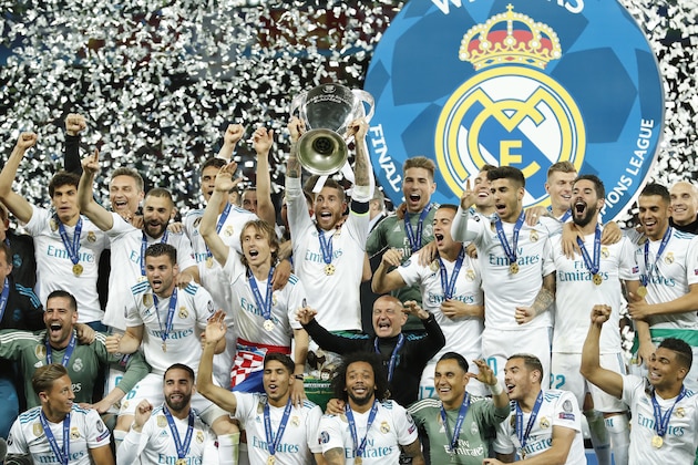 (L-R) Jesus Vallejo of Real Madrid, goalkeeper Kiko Casilla of Real Madrid, Marcos Llorente of Real Madrid, Karim Benzema of Real Madrid, Nacho of Real Madrid, Daniel Carvajal of Real Madrid, Raphael Varane of Real Madrid, Gareth Bale of Real Madrid, Luka Modric of Real Madrid, Achraf Hakimi of Real Madrid, Sergio Ramos of Real Madrid with UEFA Champions League trophy, Coupe des clubs Champions Europeens, Marcelo of Real Madrid, goalkeeper Luca Zidane of Real Madrid, Lucas Vazquez of Real Madrid, goalkeeper Keylor Navas of Real Madrid, Mateo Kovacic of Real Madrid, Marco Asensio of Real Madrid, Theo Hernandez of Real Madrid, Toni Kroos of Real Madrid, Isco of Real Madrid, Casemiro of Real Madrid, Dani Ceballos of Real Madrid during the UEFA Champions League final between Real Madrid and Liverpool on May 26, 2018 at NSC Olimpiyskiy Stadium in Kyiv, Ukraine(Photo by VI Images via Getty Images)