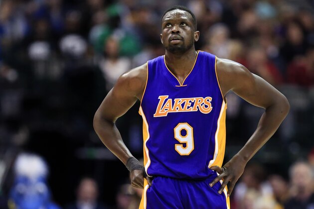 Los Angeles Lakers forward Luol Deng (9) walks toward the bench during the second half of an NBA basketball game against the Dallas Mavericks, Sunday, Jan. 22, 2017, in Dallas. (AP Photo/Ron Jenkins)