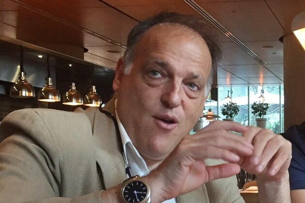 FILE - In this file photo dated  Saturday, July 29, 2017, LaLiga president Javier Tebas speaks to reporters in Miami, USA.  Tebas said in a statement to The Associated Press on Monday Sept. 4, 2017, that Abu Dhabi-funded Manchester City and Qatari-owned PSG are benefiting from state aid which distorts European competitions and “is irreparably harming the football industry.”(AP Photo/Gisela Salomon, FILE)