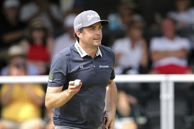 Keegan Bradley displays his ball as he celebrates a birdie on the 18th hole during the third round of the Northern Trust golf tournament, Saturday, Aug. 25, 2018, in Paramus, N.J. (AP Photo/Mel Evans)