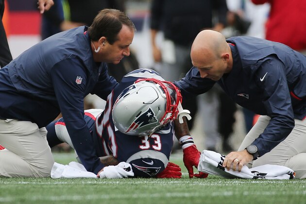 FOXBOROUGH, MA - SEPTEMBER 09:  Jeremy Hill #33 of the New England Patriots is assisted by training staff after suffering an apparent injury during the second half against the Houston Texans at Gillette Stadium on September 9, 2018 in Foxborough, Massachusetts.  (Photo by Jim Rogash/Getty Images)