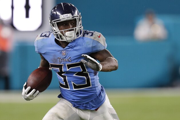 Tennessee Titans running back Dion Lewis (33) runs the ball, during the second half of an NFL football game against the Miami Dolphins, Sunday, Sept. 9, 2018, in Miami Gardens, Fla. The Dolphins defeated the Titans 27-20. (AP Photo/Brynn Anderson)