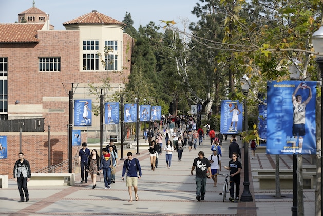FILE - In this Feb. 26, 2015, file photo, students walk on the UCLA campus in Los Angeles. The University of California says it has offered admission to nearly 70,000 California undergraduates, a slight dip from last year's historic high. Preliminary figures released Thursday, July 6, 2017, show that a total of 106,011 students, including nonresidents, were accepted as freshmen to one of the public system's nine undergraduate campuses. (AP Photo/Damian Dovarganes, File) FILE - In this Feb. 26, 2015, file photo, students walk on the UCLA campus in Los Angeles. The University of California says it has offered admission to nearly 70,000 California undergraduates, a slight dip from last year's historic high. Preliminary figures released Thursday, July 6, 2017, show that a total of 106,011 students, including nonresidents, were accepted as freshmen to one of the public system's nine undergraduate campuses. (AP Photo/Damian Dovarganes, File)