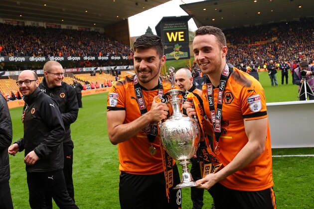WOLVERHAMPTON, ENGLAND - APRIL 28: Ruben Neves of Wolverhampton Wanderers and Diogo Jota of Wolverhampton Wanderers celebrate with the Sky Bet Championship trophy  during the Sky Bet Championship match between Wolverhampton Wanderers and Sheffield Wednesday at Molineux on April 28, 2018 in Wolverhampton, England. (Photo by Robbie Jay Barratt - AMA/Getty Images)