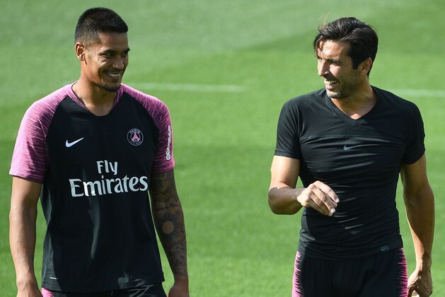 Paris Saint-Germain's French goalkeeper Alphonse Areola (L) speaks and laughs with Paris Saint-Germain's Italian goalkeeper Gianluigi Buffon (R) during a training session of the Paris Saint-Germain football team on August 24, 2018 at the Camp des Loges, in Saint-Germain-en-Laye, on the outskirts of Paris, on the eve of their French L1 football match. (Photo by FRANCK FIFE / AFP)        (Photo credit should read FRANCK FIFE/AFP/Getty Images)