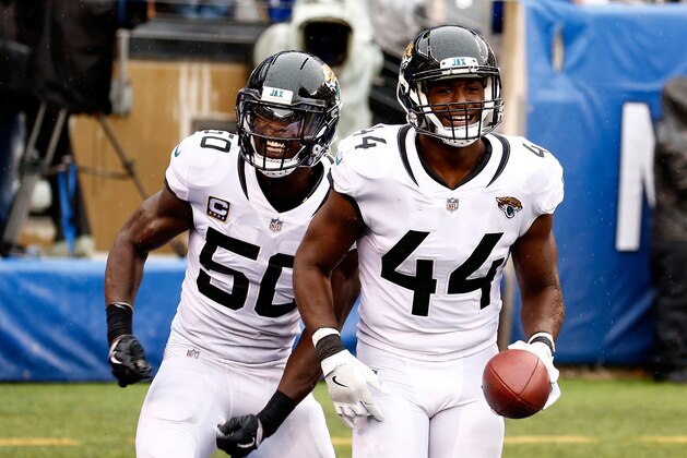 EAST RUTHERFORD, NJ - SEPTEMBER 09: Myles Jack #44 of the Jacksonville Jaguars celebrates with Telvin Smith #50 after interception a pass by Eli Manning #10 of the New York Giants in the fourth quarter and scoring a touchdown at MetLife Stadium on September 9, 2018 in East Rutherford, New Jersey.  (Photo by Jeff Zelevansky/Getty Images)