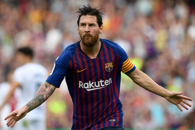 Barcelona's Argentinian forward Lionel Messi celebrates scoring his team's opening goal during the Spanish league football match between FC Barcelona and SD Huesca at the Camp Nou stadium in Barcelona on September 2, 2018. (Photo by LLUIS GENE / AFP)        (Photo credit should read LLUIS GENE/AFP/Getty Images)