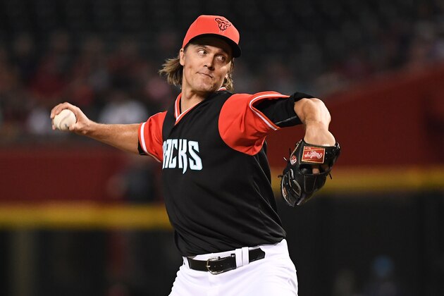 PHOENIX, AZ - AUGUST 26:  Zack Greinke #21 of the Arizona Diamondbacks delivers a pitch in the first inning of the MLB game against the Seattle Mariners at Chase Field on August 26, 2018 in Phoenix, Arizona. All players across MLB will wear nicknames on their backs as well as colorful, non-traditional uniforms featuring alternate designs inspired by youth-league uniforms during Players Weekend. (Photo by Jennifer Stewart/Getty Images)