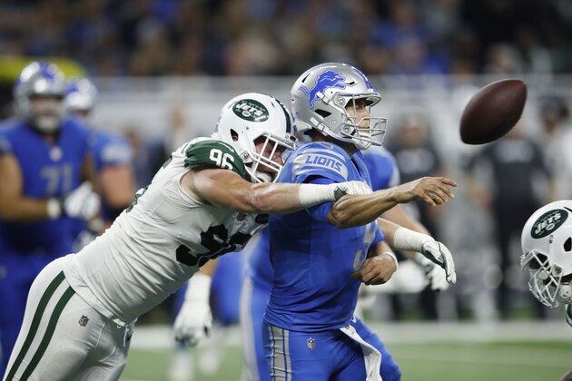DETROIT, MI - SEPTEMBER 10: Matthew Stafford #9 of the Detroit Lions throws an incomplete pass under pressure from Henry Anderson #96 of the New York Jets in the third quarter at Ford Field on September 10, 2018 in Detroit, Michigan. (Photo by Joe Robbins/Getty Images)