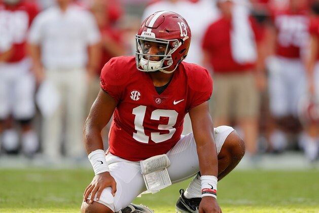 TUSCALOOSA, AL - SEPTEMBER 08:  Tua Tagovailoa #13 of the Alabama Crimson Tide waits to hold the ball for an extra point by Joseph Bulovas #97 against the Arkansas State Red Wolves at Bryant-Denny Stadium on September 8, 2018 in Tuscaloosa, Alabama.  (Photo by Kevin C. Cox/Getty Images)