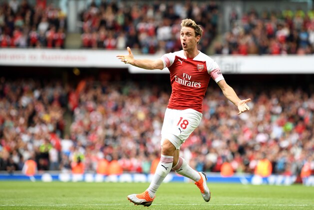 LONDON, ENGLAND - AUGUST 25:  Nacho Monreal of Arsenal celebrates after scoring his team's first goal during the Premier League match between Arsenal FC and West Ham United at Emirates Stadium on August 25, 2018 in London, United Kingdom.  (Photo by Michael Regan/Getty Images)
