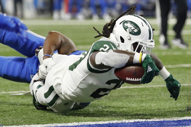 New York Jets running back Isaiah Crowell (20) reaches to score a touchdown against the Detroit Lions in the first half of an NFL football game in Detroit, Monday, Sept. 10, 2018. (AP Photo/Rick Osentoski)