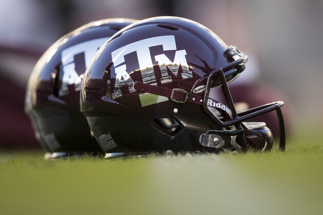 Texas A&M reflective helmets sit on the field before the start of a NCAA college football against Mississippi State on Saturday, Oct. 28, 2017, in College Station, Texas. (AP Photo/Sam Craft)