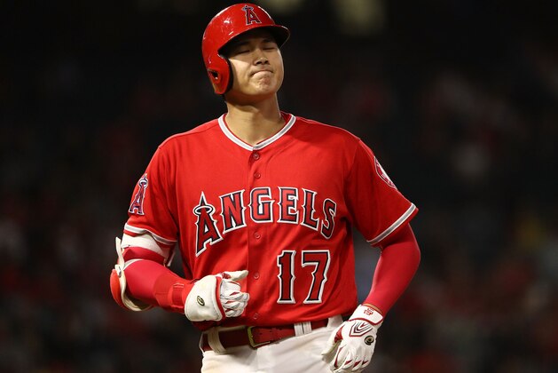 ANAHEIM, CA - SEPTEMBER 10: Shohei Ohtani #17 of the Los Angeles Angels of Anaheim reacts after flying out during the fifth inning of the MLB game at Angel Stadium on September 10, 2018 in Anaheim, California.  (Photo by Victor Decolongon/Getty Images)
