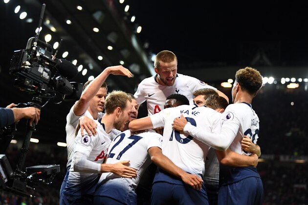 MANCHESTER, ENGLAND - AUGUST 27:  Lucas Moura of Tottenham Hotspur (hidden) celebrates with team mates after scoring his second goal and his team's third goal during the Premier League match between Manchester United and Tottenham Hotspur at Old Trafford on August 27, 2018 in Manchester, United Kingdom.  (Photo by Clive Mason/Getty Images)