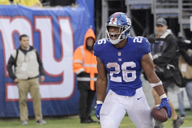 New York Giants running back Saquon Barkley (26) celebrates after rushing 68 yards for a touchdown during the second half of an NFL football game against the Jacksonville Jaguars Sunday, Sept. 9, 2018, in East Rutherford, N.J. (AP Photo/Bill Kostroun)