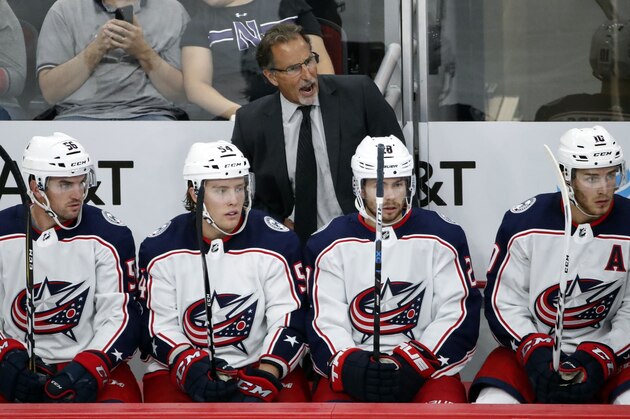 FILE - In this Sept. 23, 2017, file photo, Columbus Blue Jackets head coach John Tortorella, top center, yells to his team during the third period of a preseason NHL hockey game against the Chicago Blackhawks in Chicago. The Jackets host the New York Islanders in the season opener Friday night (AP Photo/Kamil Krzaczynski, File)