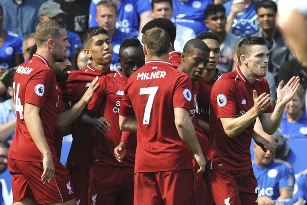 Liverpool's Sadio Mane, centre, celebrates after scoring his side's first goal with teammates during the English Premier League soccer match between Leicester City and Liverpool at the King Power Stadium in Leicester, England, Saturday, Sept. 1, 2018. (AP Photo/Rui Vieira)