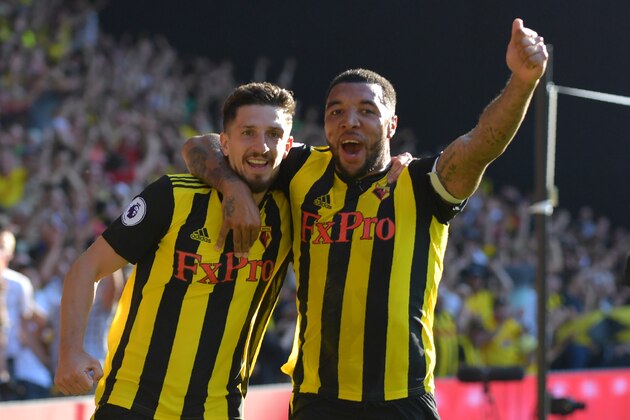 Watford's Northern Irish defender Craig Cathcart (L) celebrates with Watford's English striker Troy Deeney after scoring their second goal during the English Premier League football match between Watford and Tottenham Hotspur at Vicarage Road Stadium in Watford, north of London on September 2, 2018. (Photo by OLLY GREENWOOD / AFP) / RESTRICTED TO EDITORIAL USE. No use with unauthorized audio, video, data, fixture lists, club/league logos or 'live' services. Online in-match use limited to 120 images. An additional 40 images may be used in extra time. No video emulation. Social media in-match use limited to 120 images. An additional 40 images may be used in extra time. No use in betting publications, games or single club/league/player publications. /         (Photo credit should read OLLY GREENWOOD/AFP/Getty Images)
