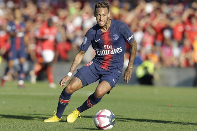 PSG's Neymar goes for the ball during their League One soccer match between Nimes and Paris Saint-Germain at Jean-Bouin stadium in Nimes, southern France, Saturday Sept. 1, 2018. (AP Photo/Claude Paris)