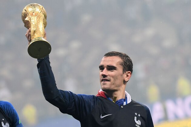 France's forward Antoine Griezmann lifts the Fifa World Cup trophy after the Russia 2018 World Cup final football match between France and Croatia at the Luzhniki Stadium in Moscow on July 15, 2018. - France won the World Cup for the second time in their history after beating Croatia 4-2 in the final in Moscow's Luzhniki Stadium on Sunday. (Photo by Jewel SAMAD / AFP) / RESTRICTED TO EDITORIAL USE - NO MOBILE PUSH ALERTS/DOWNLOADS        (Photo credit should read JEWEL SAMAD/AFP/Getty Images)