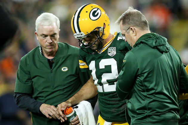 GREEN BAY, WI - SEPTEMBER 09:  Aaron Rodgers #12 of the Green Bay Packers is helped off the field after being injured in the second quarter against the Chicago Bears at Lambeau Field on September 9, 2018 in Green Bay, Wisconsin. (Photo by Dylan Buell/Getty Images)