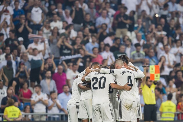MADRID, SPAIN - SEPTEMBER 01: Players of Real Madrid celebrate for teammate Karim Benzema's scoring his second goal as soccer fans of the team applaud at the stand during the La Liga match between Real Madrid CF and CD Leganes at Estadio Santiago Bernabeu on September 1, 2018 in Madrid, Spain. (Photo by Power Sport Images/Getty Images)