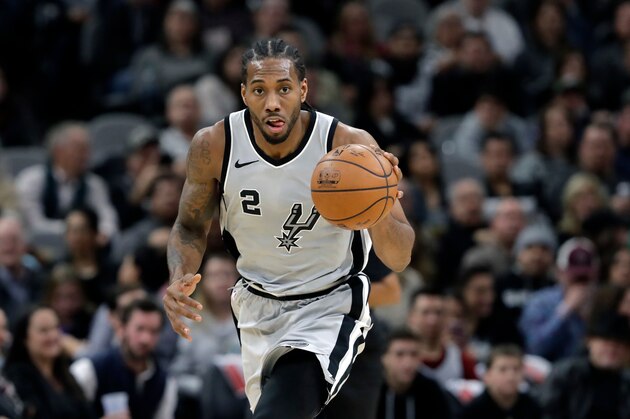 FILE - In this Jan. 13, 2018, file photo, San Antonio Spurs forward Kawhi Leonard (2) moves the ball up court during the second half of an NBA basketball game against the Denver Nuggets, in San Antonio. General manager R.C. Buford acknowledges star forward Kawhi Leonard is unhappy with the Spurs. He remains optimistic the relationship can be salvaged. (AP Photo/Eric Gay, File)