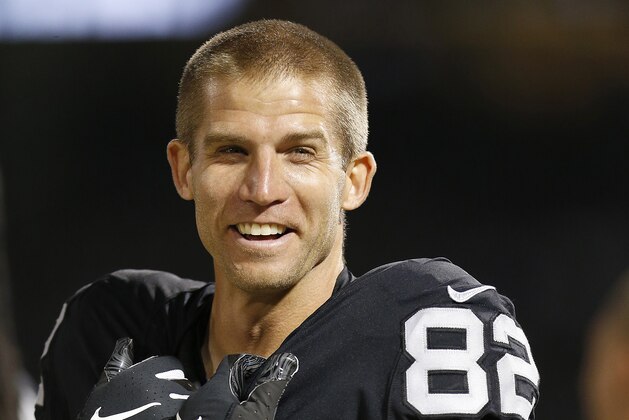 Oakland Raiders wide receiver Jordy Nelson (82) smiles on the sideline during the first half of an NFL preseason football game against the Green Bay Packers in Oakland, Calif., Friday, Aug. 24, 2018. (AP Photo/D. Ross Cameron)