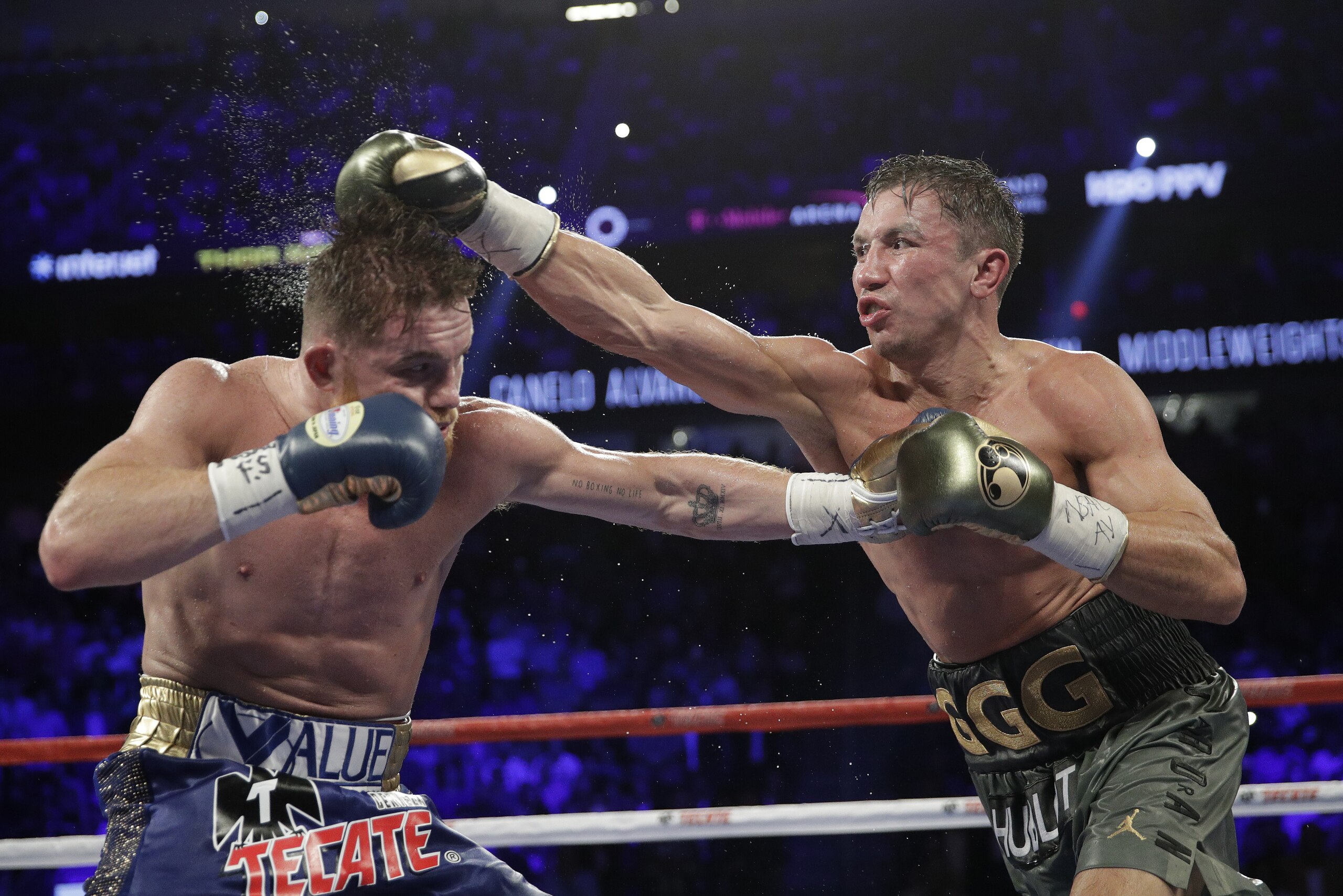 Gennady Golovkin, right, connects with a right to Canelo Alvarez during a middleweight title fight Sunday, Sept. 17, 2017, in Las Vegas. (AP Photo/John Locher) Gennady Golovkin, right, connects with a right to Canelo Alvarez during a middleweight title fight Sunday, Sept. 17, 2017, in Las Vegas. (AP Photo/John Locher)
