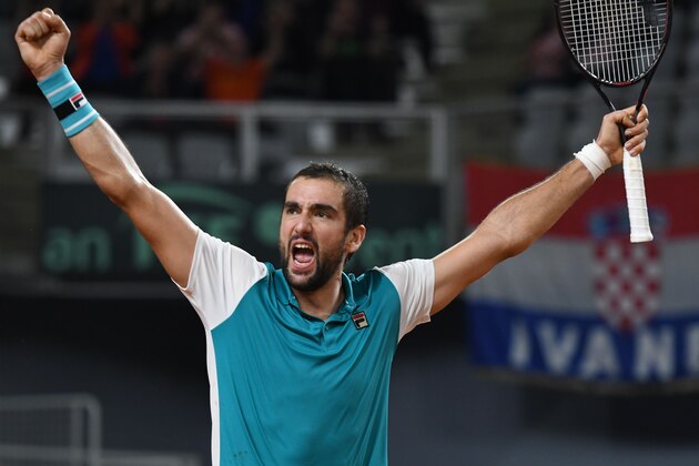 Croatia's Marin Cilic celebrates after winning against Kazahstan's Mihail Kukuskin during the Davis Cup World Group quarter-final single tennis match between Croatia and Kazahstan at the Arena hall in Varazdin on April 8, 2018.  / AFP PHOTO / -        (Photo credit should read -/AFP/Getty Images)