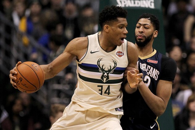 MILWAUKEE, WI - FEBRUARY 25:  Giannis Antetokounmpo #34 of the Milwaukee Bucks dribbles the ball while being guarded by Anthony Davis #23 of the New Orleans Pelicans in the fourth quarter at the Bradley Center on February 25, 2018 in Milwaukee, Wisconsin. NOTE TO USER: User expressly acknowledges and agrees that, by downloading and or using this photograph, User is consenting to the terms and conditions of the Getty Images License Agreement. (Photo by Dylan Buell/Getty Images)