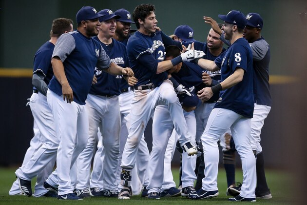 MILWAUKEE, WI - SEPTEMBER 03:  Christian Yelich #22 of the Milwaukee Brewers celebrates with teammates after beating the Chicago Cubs 4-3 at Miller Park on September 3, 2018 in Milwaukee, Wisconsin. (Photo by Dylan Buell/Getty Images)