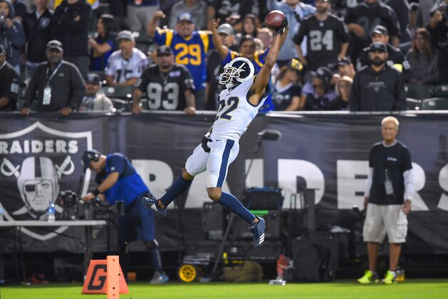 OAKLAND, CA - SEPTEMBER 10:  Marcus Peters #22 of the Los Angeles Rams dives into the endzone after an interception of Derek Carr #4 of the Oakland Raiders in the fourth quarter of their NFL game at Oakland-Alameda County Coliseum on September 10, 2018 in Oakland, California.  (Photo by Thearon W. Henderson/Getty Images)