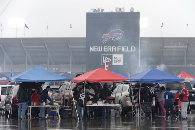 Fans tailgate prior to an NFL football game between the Buffalo Bills and the Oakland Raiders, Sunday, Oct. 29, 2017, at New Era Field in Orchard Park, N.Y. (AP Photo/Adrian Kraus)