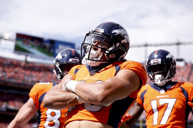 Denver Broncos running back Phillip Lindsay, center, reacts after scoring a touchdown during the first half of an NFL football game against the Seattle Seahawks Sunday, Sept. 9, 2018, in Denver. (AP Photo/David Zalubowski)