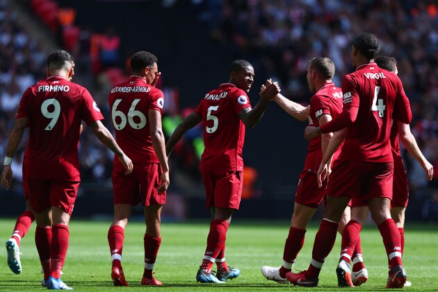 LONDON, ENGLAND - SEPTEMBER 15:  Georginio Wijnaldum of Liverpool celebrates with teammates after scoring his team's first goal during the Premier League match between Tottenham Hotspur and Liverpool FC at Wembley Stadium on September 15, 2018 in London, United Kingdom.  (Photo by Clive Rose/Getty Images)