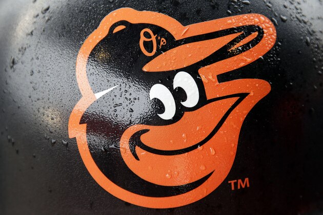 Rain drops stick to a Baltimore Orioles logo on a concourse trash can before a home opener baseball game against the Toronto Blue Jays, Friday, April 10, 2015, in Baltimore, as wet weather threatened the area. (AP Photo/Patrick Semansky)