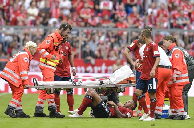 Bayern Munich's French midfielder Corentin Tolisso lies injured on the pitch during the German First division Bundesliga football match between FC Bayern Munich and Bayer Leverkusen in Munich, on September 15, 2018. (Photo by Guenter SCHIFFMANN / AFP) / DFL REGULATIONS PROHIBIT ANY USE OF PHOTOGRAPHS AS IMAGE SEQUENCES AND/OR QUASI-VIDEO        (Photo credit should read GUENTER SCHIFFMANN/AFP/Getty Images)