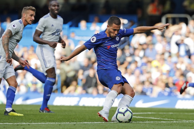 Chelsea's Eden Hazard scores his side's first goal during their English Premier League soccer match between Chelsea and Cardiff City at Stamford Bridge stadium in London Saturday, Sept. 15, 2018. (AP Photo/Alastair Grant)
