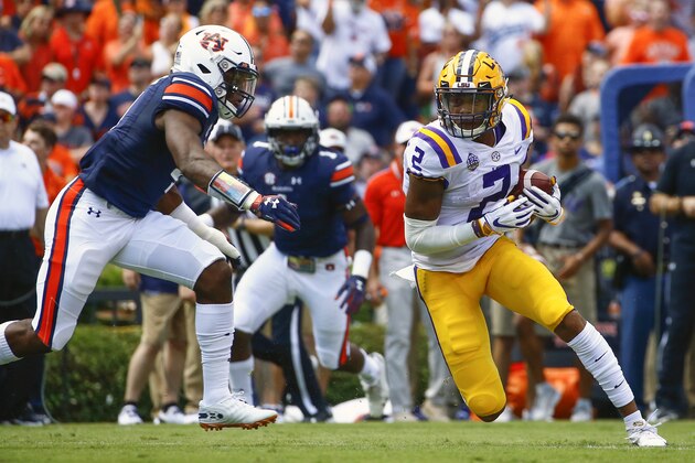 LSU wide receiver Justin Jefferson (2) catches a pass and tries to get around Auburn defensive back Noah Igbinoghene (4) as he carries the ball during the first half of an NCAA college football game, Saturday, Sept. 15, 2018, in Auburn, Ala. (AP Photo/Butch Dill)
