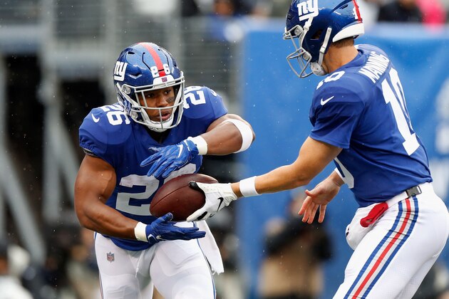 EAST RUTHERFORD, NJ - SEPTEMBER 09:  (NEW YORK DAILIES OUT)   Saquon Barkley #26 and Eli Manning #10 of the New York Giants in action against the Jacksonville Jaguars on September 9, 2018 at MetLife Stadium in East Rutherford, New Jersey. The Jaguars defeated the Giants 20-15.  (Photo by Jim McIsaac/Getty Images)