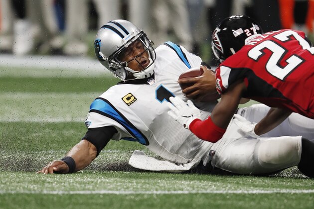Carolina Panthers quarterback Cam Newton (1) slides down as Atlanta Falcons cornerback Damontae Kazee (27) prepares to hit Newton during the first half of an NFL football game, Sunday, Sept. 16, 2018, in Atlanta. Kazee was ejected from the game after the hit. (AP Photo/John Bazemore)